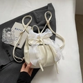 Elegant cream small backpack with a large lace bow accent and slim faux leather straps - Off White