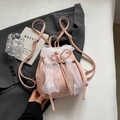 Pink velvet backpack for women featuring a white lace bow detail and adjustable straps - Pink