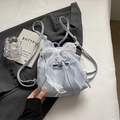 Light blue mini backpack featuring a delicate white lace bow and drawstring closure - Blue