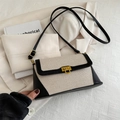 Bolso bandolera de lona bicolor y cuero negro con hebilla metálica dorada elegante - Negro