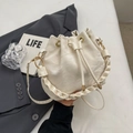 Chic cream white bucket bag with drawstring closure and stylish braided leather handle - No Pendant / Off-White (Without Pendant)