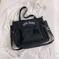 Versatile black multi-pocket tote bag with white DUO NING logo and adjustable strap - Black