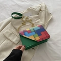 Green leather crossbody bag with colorful geometric flap and gold chain strap - Green