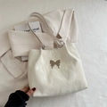 Chic off-white tote bag with marble texture fabric and silver butterfly buckle detail - White