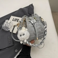 Silver drawstring bucket bag with pleated metallic texture and plush monster charm - Silver (With Pendant)