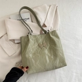 Sage green pleated shoulder bag with silver butterfly charm and chain strap detail - Green