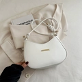 White minimalist croissant shoulder bag with knotted straps and gold metal accent - White