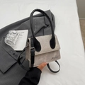 Piccola borsa retrò grigia in patchwork con manico nero e logo in metallo argento - Kaki
