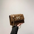 Coffee brown chain crossbody bag with bow hardware and quilted diamond pattern - Brown