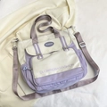 Cream and purple canvas tote bag with adjustable shoulder strap and multiple pockets - White and Purple