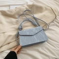 Light blue marble texture handbag with knot handles and crossbody strap on fabric - Blue