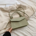 Pale green handbag with marble texture, knotted handle, and adjustable crossbody strap - Green