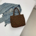 Dark brown corduroy tote bag featuring a cute strawberry print and wide handles - Brown