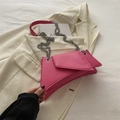 Fuchsia geometric shoulder bag with silver chain strap on a white blazer background - Rose Pink