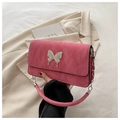 Detailed shot of pink pleated leather bag with white butterfly buckle and silver chain strap - Rose Pink
