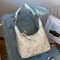 Blue New Chinese style shoulder bag with floral embroidery and beaded pendant detail - Blue