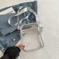 Transparent PVC crossbody bag with silver-grey strap and dual zippers for travel - Silver
