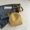 Mustard yellow nylon crossbody shell bag with adjustable strap and fashion label detail - Yellow