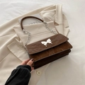 Dark brown leather flap bag with butterfly buckle and silver chain strap - Brown