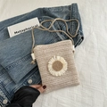 Mini beige straw crossbody bag featuring a woven daisy accent and slim cord strap - Off White