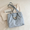 Light blue tote bag with wrinkled texture, silver chain and pearl butterfly charm - Blue