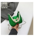 Detail of green sequin mini bag with pearl handle and silver bow clasp decoration - Green