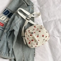 White corduroy crossbody bag with red strawberry print and adjustable strap - White