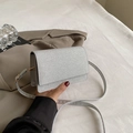 Sparkling silver sequin crossbody bag with thin shoulder strap and gold metallic buckle - Silver