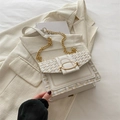 Elegant cream tweed crossbody bag with gold chain strap and metallic oval clasp - White