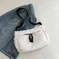 Minimalist white nylon crossbody bag with black zipper detail and adjustable strap - White