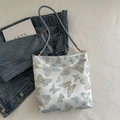 Elegant white tote bag with blue butterfly jacquard pattern and slim leather strap - Butterfly