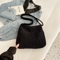 Minimalist black corduroy crossbody bag with adjustable wide strap and ribbed texture - Black