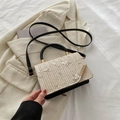 Beige woven crossbody bag with pink flower embroidery and black leather trim accents - Black