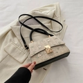 Handwoven straw bag with floral embroidery and black leather trim accents - Black