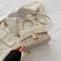Beige straw woven crossbody bag with pink floral embroidery and golden metal lock - White