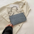 Blue suede chain bag with silver beaded trim on a beige suit, stylish small square purse - Blue