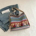 Bunte Bohème-Stofftasche mit geometrischen Mustern und mehrfarbigen Quasten - Blau