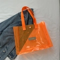 Transparent bright orange PVC tote bag with matching webbed handles and snap button - Orange
