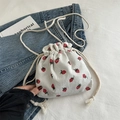 White corduroy bucket bag with cute strawberry prints and cotton rope shoulder straps - White
