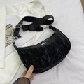 Modern black crescent shoulder bag with pleated texture and adjustable strap - Black
