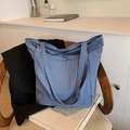 Large capacity Morandi blue tote bag with front pocket on vintage chair - Blue