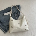 White hobo shoulder bag with eel pattern texture and silver butterfly ornaments - White