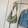 Light green nylon drawstring crescent crossbody bag with wide adjustable shoulder strap - Green