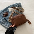 Brown litchi leather crossbody bag with geometric woven strap and fringe tassel charm - Brown