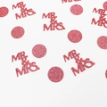 Close-up of pink glittery MR & MRS confetti and circular dots for wedding decor - Rose Gold Mr&Mrs and Circles