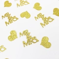 Close-up of gold glitter Mr & Mrs and heart confetti for wedding party decorations - Gold Mr&Mrs and Gold Hearts