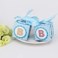 Light blue baby shower gift box with B letter print and satin ribbon on white plate - Blue