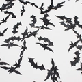 Glittery black bat confetti for Halloween party decor scattered on white background - Glitter Black Bat