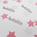 Macro shot of silver glitter twinkle letters and star confetti for baby shower party decor - Silver With Pink White Stars