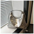 Detail of silver metallic leather tote with 3D butterfly accents and Y2K pleats - Silver